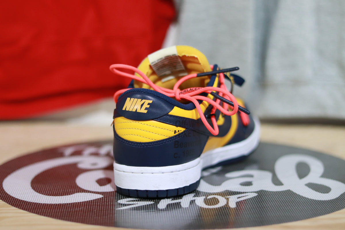 Nike dunk low x off-white michigan best sale